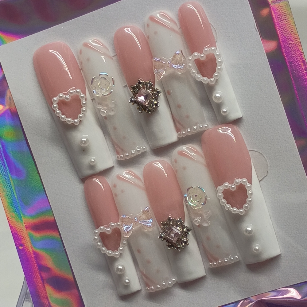 Pink and White Nail Art Set with Heart and Pearl Accents